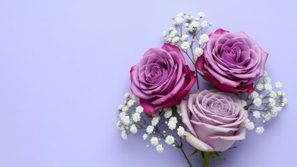 Elegant arrangement featuring lavender roses and baby's breath on soft pastel background