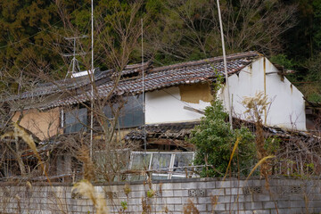 An abandoned house in a dilapidated marginal village