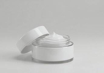 open jar of white cream on gray surface for skincare routine