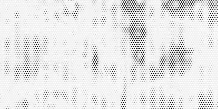 Black and white halftone spotted background. Gray color sports clothing fabric texture and textile background. Black dots on a gray background. Close-up of a offset printed poster.