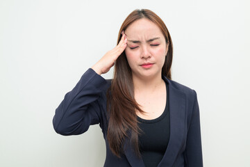 Obraz premium Stressed person with hand on forehead headache businesswoman in 20s in suit