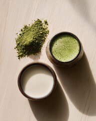 Top View Flat Lay of Matcha Latte Ingredients with Green Tea Powder and Milk in Ceramic Cups on Wooden Background, Japanese Wellness Concept