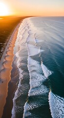 Aerial view of a stunning shoreline during sunset, waves crashing, reflecting golden sunlight on the wet sand and ocean