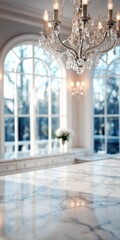 Polished marble countertop with a crystal chandelier above.
