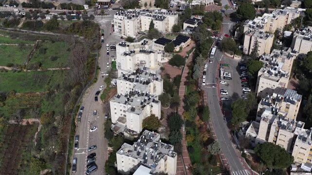 
Aerial Kiryat Arba Neighborhood Israel

Drone footage of residential blocks, streets, and green areas in Kiryat Arba, November 2025, Israel
