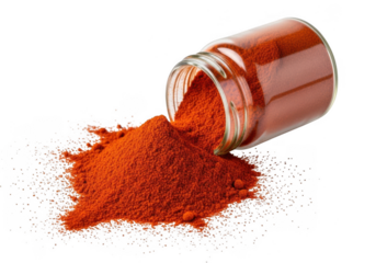 A small glass jar of bright red paprika spice tipped over, spilling a mound of powder onto a clean transparent background, isolated on transparent background