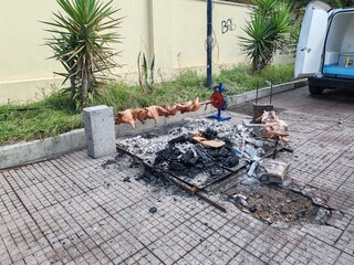Ostia, Rome, Italy - October 5, 2025, a spit for cooking porceddu (or porcheddu), the Sardinian name for roast suckling pig, during the Sardinian Days in Ostia. © Stefano