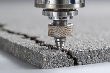 Sealant Applicator Applying Sealant to a Concrete Crack