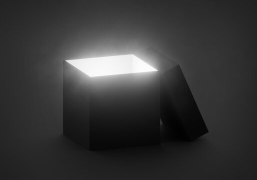 Mysterious magical box opening with rays of light, high contrast image