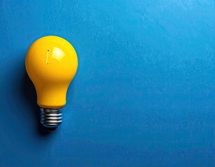 Bright yellow lightbulb set on a blue background for ideas