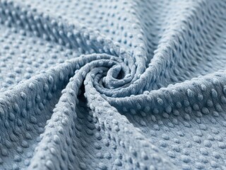 Soft blue textured fabric swirls in a cozy display