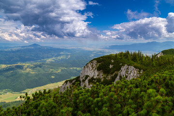 Naklejka premium Summer scenery in the Transylvanian Alps with spectacular imagery and dramatic storm clouds, in July and August