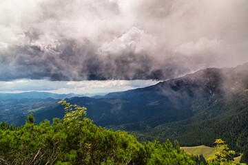 Summer scenery in the Transylvanian Alps with spectacular imagery and dramatic storm clouds, in July and August