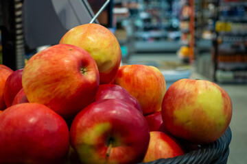 Fresh red and yellow apples in a basket