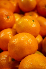 Fresh oranges stacked together, vibrant and juicy