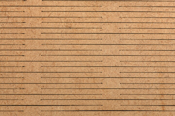 Detailed Texture of Slotted Brown Wood Fiberboard Surface Background