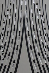 Close-up abstract texture of steam iron soleplate with steam vents