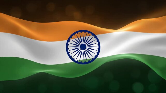 The Indian flag waving with vibrant orange, white, and green stripes and a blue wheel emblem on a dark background with bokeh lights.
