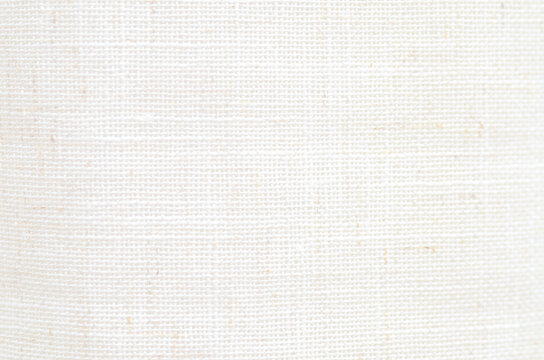 Close-up of Natural Cream Linen Fabric Texture with Coarse Woven Grid Pattern