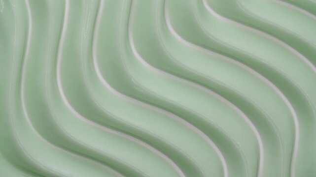 Moisturising creme swatch motion with spatula. Skin care light creamy cosmetic beauty product smudge closeup video. Cream texture footage. Skincare cosmetics sunscreen lotion mousse close up. 4k