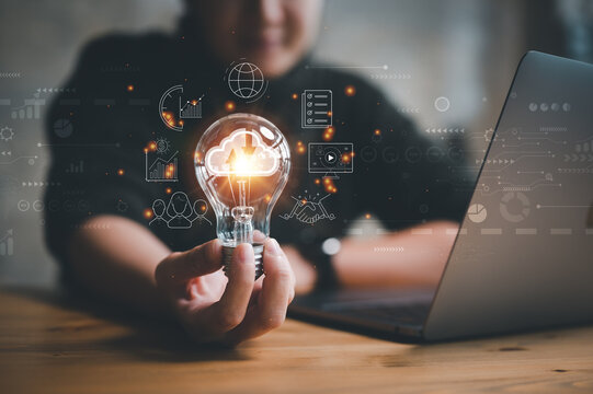 woman Hand holding Light bulb Global Internet connection. Business global internet connection application technology and digital marketing, Financial and banking, Digital link tech, big data. - Powered by Adobe