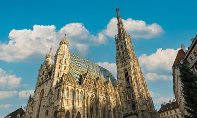Beautiful St. Stephen's Cathedral features a stunning Gothic facade and a vibrant roof of 230,000 colorful tiles depicting the imperial double-headed eagle.