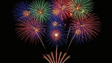 Fototapeta premium Vibrant fireworks illuminating the night sky with a dazzling display of colorful explosions and bursts of light, creating a festive and celebratory atmosphere