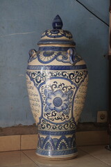 Ornate Blue and White Ceramic Urn with Intricate Floral and Geometric Patterns.
