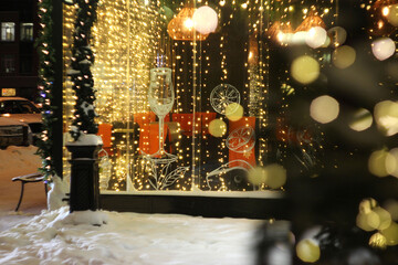 A cafe veranda decorated with garlands.