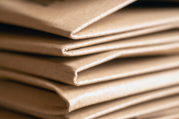 Closeup Of Kraft Paper Envelopes Stacked In A Layered Tan Paper Packaging Scene