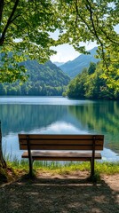 Obraz premium Wooden bench by a peaceful lake with a scenic view.
