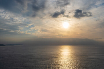 Golden light reflecting on Atlantic Ocean at sunset in Nazar&eacute;