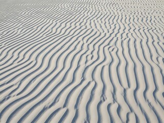 Clean Beach Sand Ripples from Above, Soft Natural Wave Pattern Texture Background
