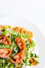 Close-Up of Chicken Kapsalon with Turkish Doner on White Plate