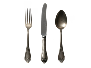 Luxurious silverware set including fork, knife, and spoon with intricate designs isolated on transparent background