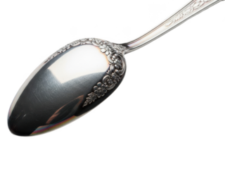A close-up of a luxurious silver spoon with intricate floral designs on its handle and bowl, perfect for formal dining isolated on transparent background