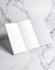 Blank Tri-Fold Brochure Mockup on Marble Surface.