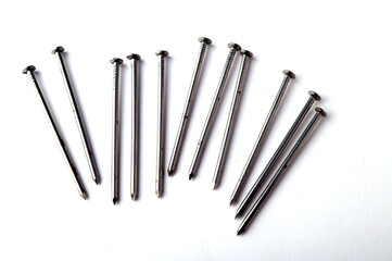 Pile of metal nails isolated on white background