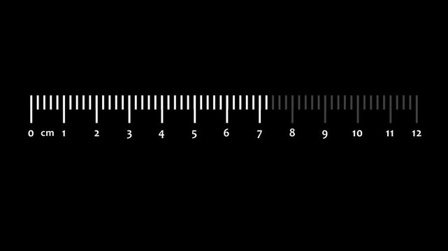 A ruler with centimeter markings from 0 to 12 on a black background image photo
