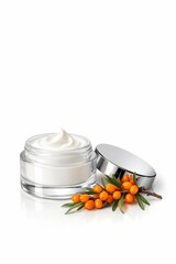 Glass jar of cream, accompanied by branch of sea buckthorn berries on white background. Close-up of cosmetic moisturizer in clear container. Beauty product. Vertical banner with copy space