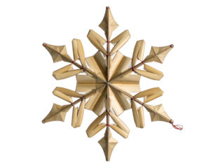 Intricate golden snowflake ornament with red accents, isolated