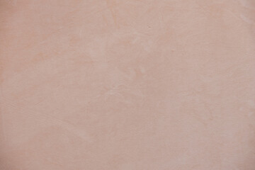 Soft beige textured background with subtle plaster wall surface. Minimal neutral backdrop with natural warm tones, ideal for branding, web design, packaging, social media or print templates.
