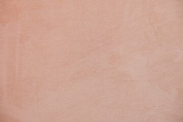 Soft warm beige textured background with subtle plaster wall surface. Minimal neutral backdrop with gentle tones, ideal for web design, branding, packaging, social media or print layouts.
