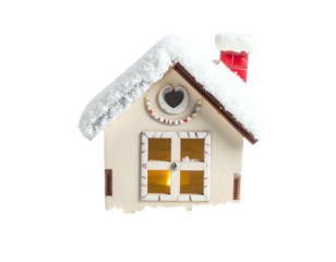 Cozy winter house ornament with snow-capped roof and glowing window