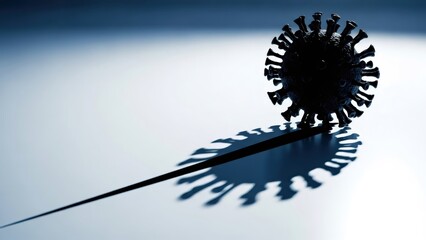 Dark virion model casting shadow like a graph on a bright background. Coronavirus pandemic healthcare and global economy crisis concept with copy space.