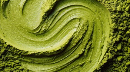 Obraz premium Delicate matcha powder, featuring subtle green ripple patterns and smooth swirls, highlighting the natural vibrant color of the green tea powder and its fine, powdery texture.