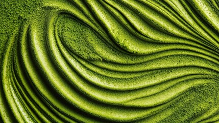 Delicate matcha powder, featuring subtle green ripple patterns and smooth swirls, highlighting the natural vibrant color of the green tea powder and its fine, powdery texture.