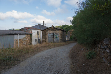 Traditional rural stone house with wooden gallery and slate roof