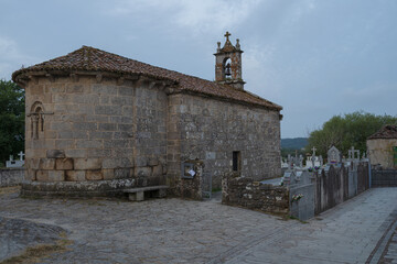 Traditional rural stone house with wooden gallery and slate roof