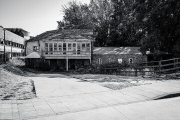 Traditional rural stone house with wooden gallery and slate roof